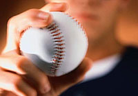 ball player presenting a baseball