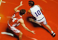 overhead shot of two basketball players during a game in progress
