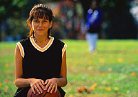 young girl posing for the camera while taking a break from a basketball game