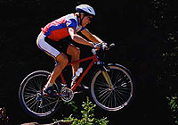 mountain biker jumping the trail