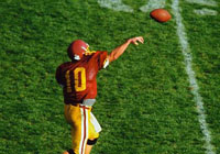 A quarterback is making a pass