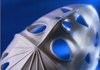 hockey goalie mask resting on the ice rink