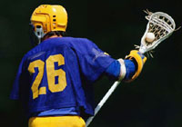 lacrosse player searching for team members to pass to