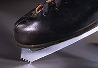 a skater using his toe pick on the ice