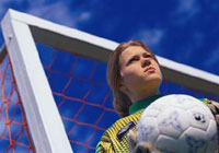 female soccer goalie looking out onto the field