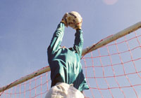 soccer goalie blocking a shot